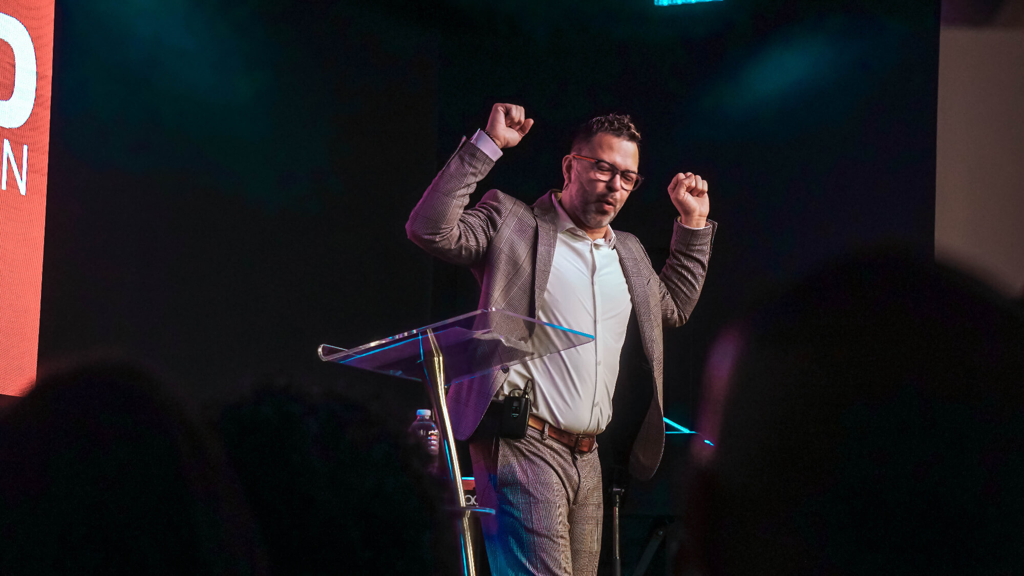 pastor raising hands